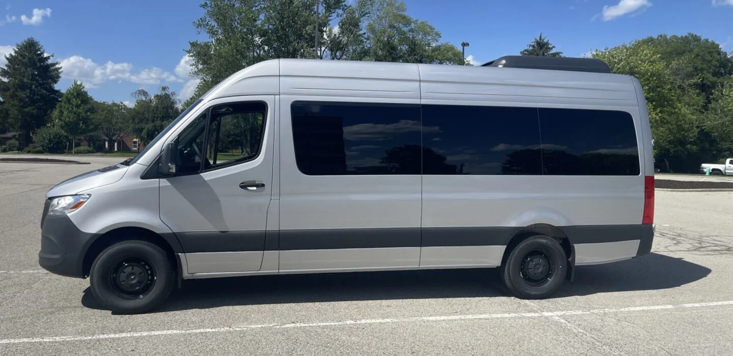 Lightning Limo 14-passenger Sprinter for game-day group transportation